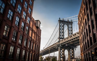 Shot of the GWB from below. Tall apartment buildings are in the foreground.