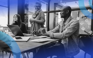 Diversity, equity and inclusion executives sitting at a conference table.