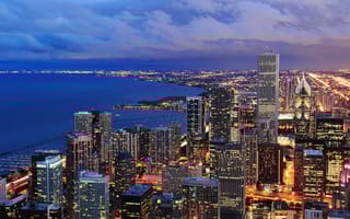 Chicago skyline at night looking over Lake Michigan