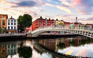 A photo of the Ha Penny Bridge in Dublin Ireland at sunset.