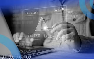 software engineer receiving a system hack alert on laptop