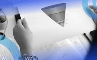 A salesperson is holding a sheet of paper depicting a sales funnel.