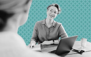 A hiring manager listens to a response from a job applicant.