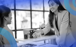 Employer interviewing a job candidate and shaking hands