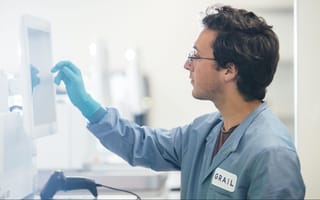 GRAIL scientist reviewing results on a computer in a lab