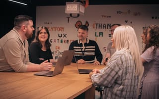 Rapid7 team members gathering to discuss a project.
