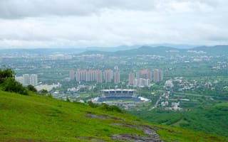Pune skyline from a lush, green hill