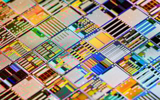 A close-up photo of a colorful silicon wafer, which is a component of a semiconductor.