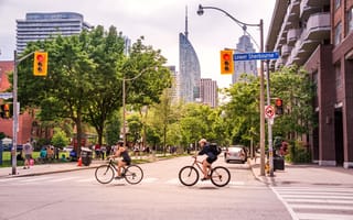 Two Torontonians biking on a local street.