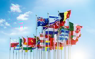 Set of flags fluttering in the wind against blue background.