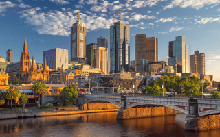 An aerial view of Melbourne and its river on a sunny day