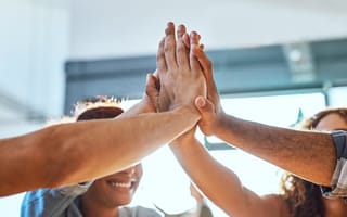 office workers high five