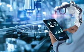 Engineer programs industrial automation system.