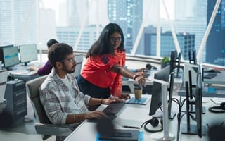 Fintech developers work on new product.