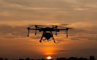 drone flying at sunset