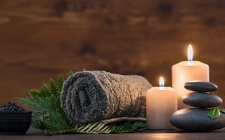 stones, towel and candle