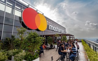 An exterior photo of a building in Pune, India featuring the Mastercard logo.