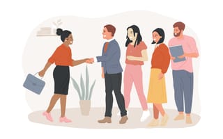 A new employee shakes with the first of four coworkers.