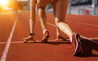 Runner on starting mark of track.