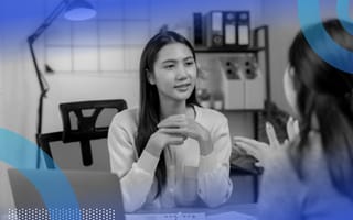 A woman giving feedback to her colleague.