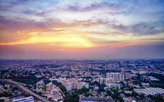 A view of the Bengaluru skyline at sunset.
