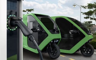 Electric scooters at charging station.