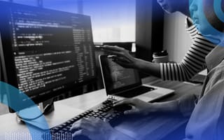 Developers coding in JavaScript and reviewing code