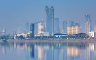 The Mumbai, Maharashtra skyline along the water.