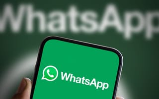 Phone with WhatsApp mobile application open.
