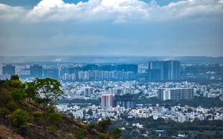 A skyline view of Pune, Maharashtra taken from a hillside.