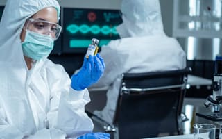 Scientists analyze pharmaceutical product.