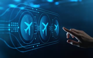 Hand reaching out to touch digital aviation icons.