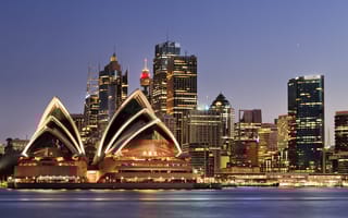 A photo of the Sydney skyline at night.