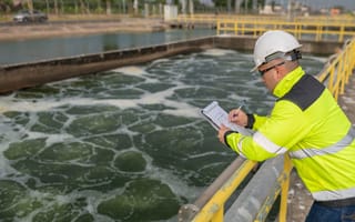 worker checking water data