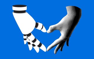 A robot and human hand form a heart.
