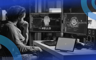 A machine learning engineer works on two computer terminals