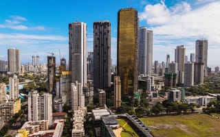 An aerial view of the Mumbai financial district featuring several skyscrapers.