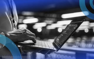 Data center manager reviewing computer