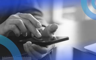 A close-up of someone’s hands while using a smart mobile phone.