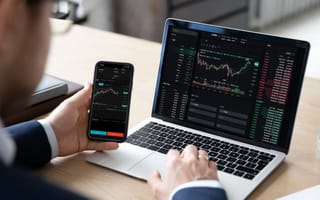 Investors looks of stock data.