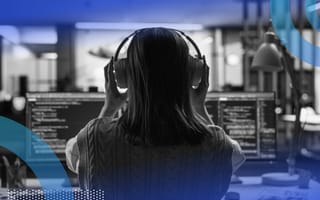 Engineer with headphones on focusing