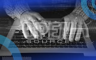 An engineer types on a computer with the words "open source" overlaid