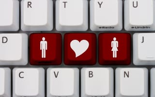 Keyboard highlighting three red keys to represent online dating.