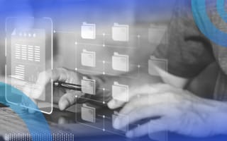 A visual representation of a database floats over a laptop