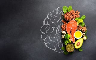 An image of healthy food next to a chalk drawing of a brain is shown.