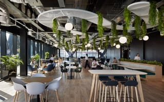 An interior photo of BT's Manchester office is shown.