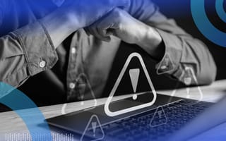 Developer receiving multiple error signs on laptop