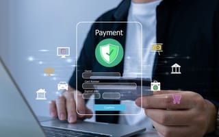 A digital illustration of a payment app hovers in front of a close up of a hand holding a credit card to represent a person using a fintech platform.