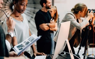 A group of multiple advertising professionals at work