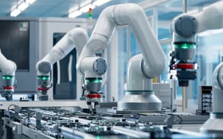 A robotic arm on a factory line to represent automation.